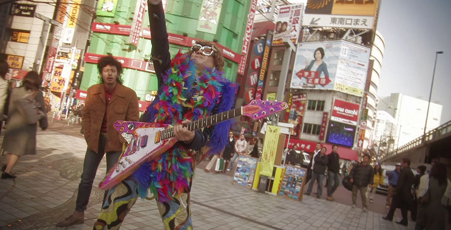 Fumiya is mesmerised by a glam dressed guitar player
