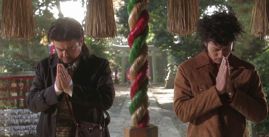 Aiichiro and Fumiya pray at a significant shrine