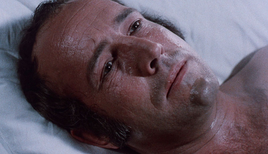 Ian Hendry as The Assassin wakes from a troubled dream