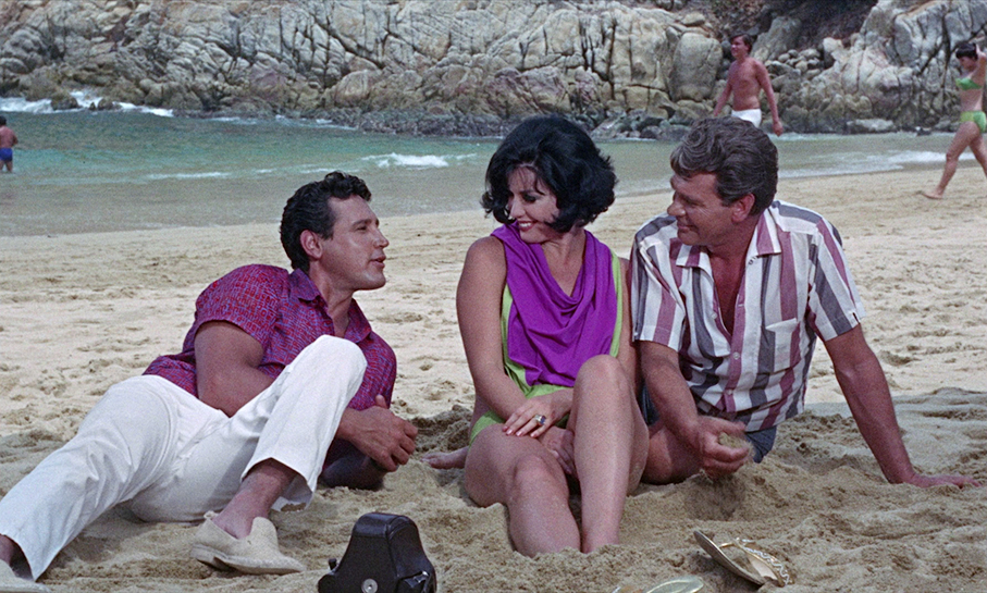 Mario and Carlo talk beusiness with Gloria on the beach