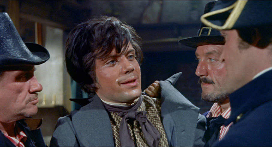 An injured Oliver Reed is defiant in the face of the King's men