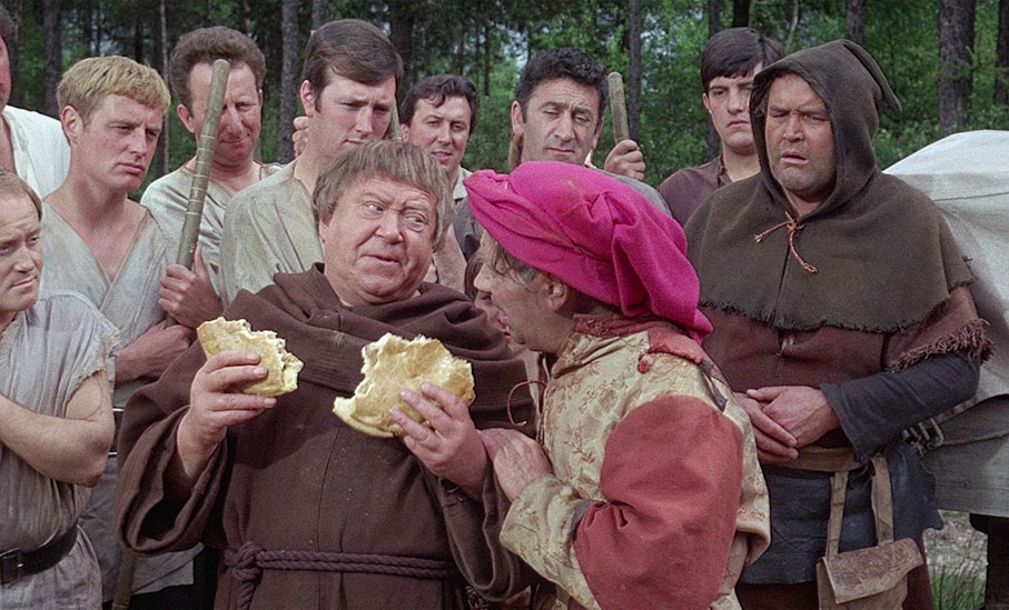 Friar Tuck sample the pie merchant's wares