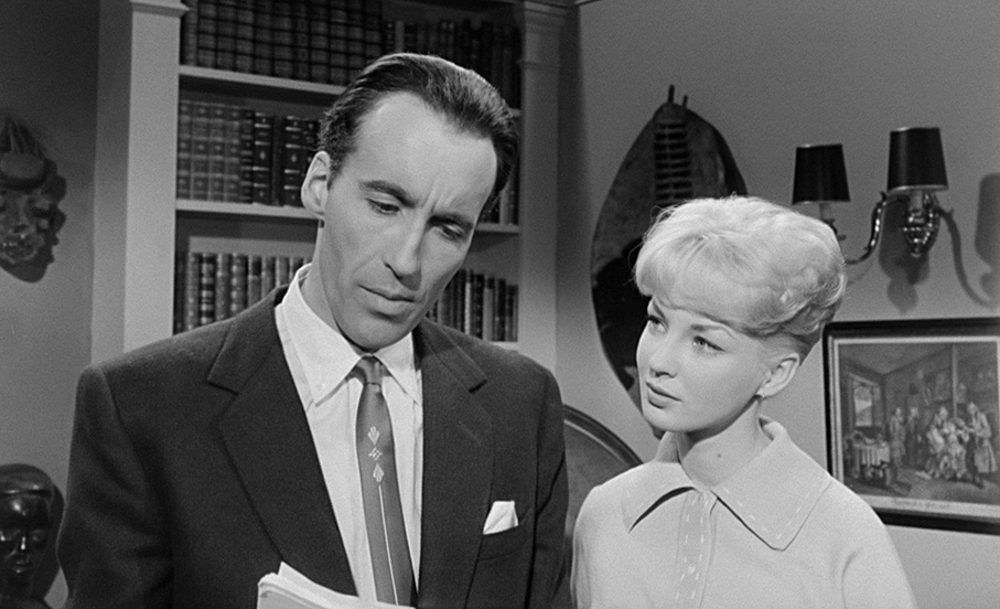 Professor Driscoll (Christopher Lee) and Nan Barlow (Venetia Stevenson)