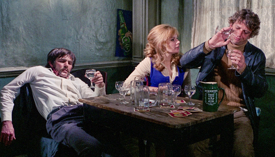 Bernie mixes his drinks as Nicolas slips into unconsciousness as Tonie tries to reason with him