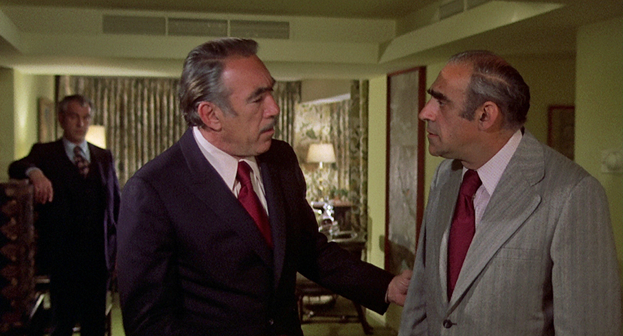 Don Angelo (Anthonthy Quinn) consults with Don Talusso (Abe Vigoda)