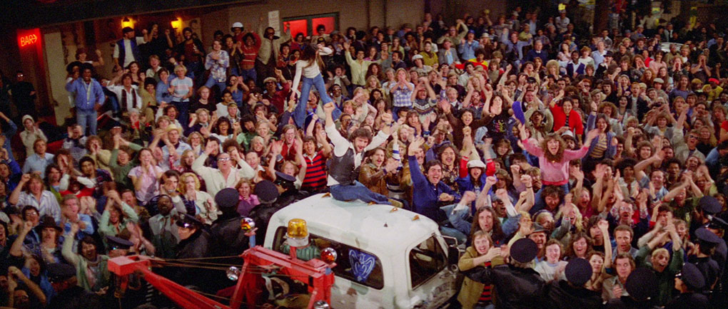 A crowd gathers outside the studio