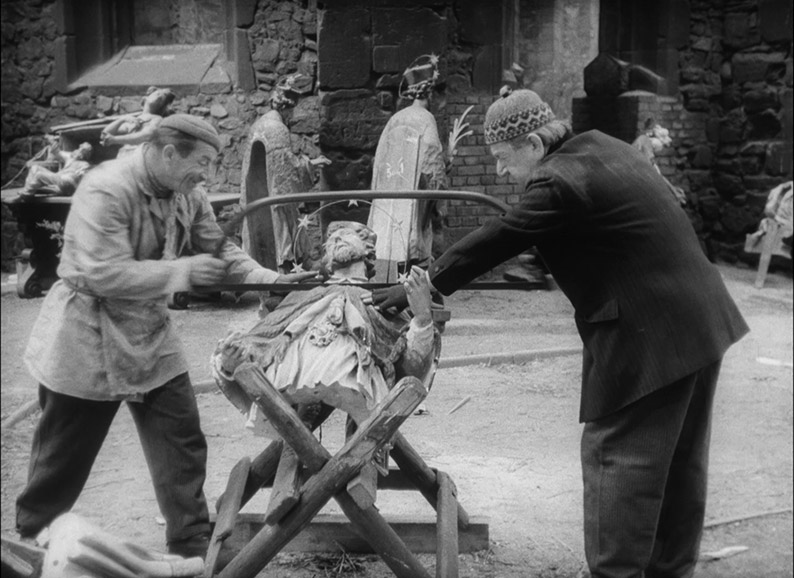 cutting up religious statues for scrap in The Junk Shop