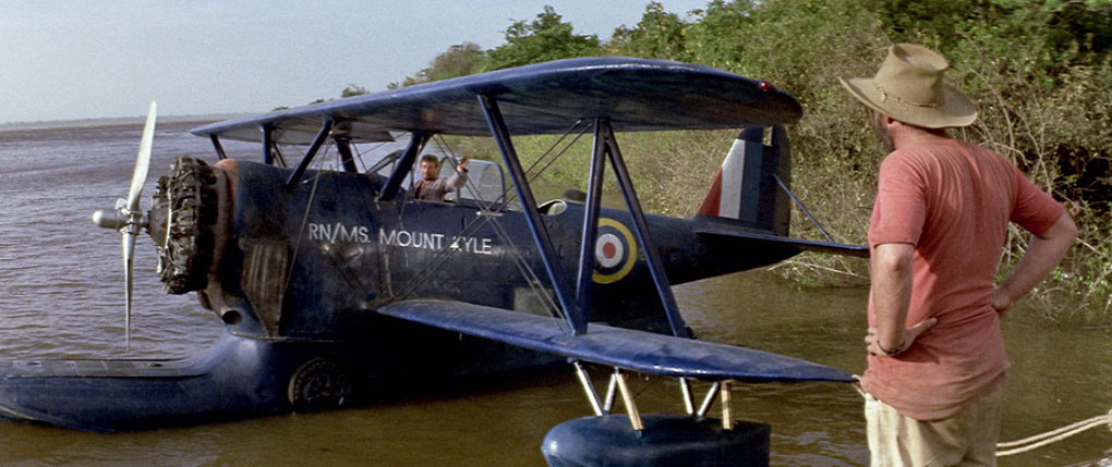 Murphy prepares to try and get the newly repaired plane into the air as Louis looks on