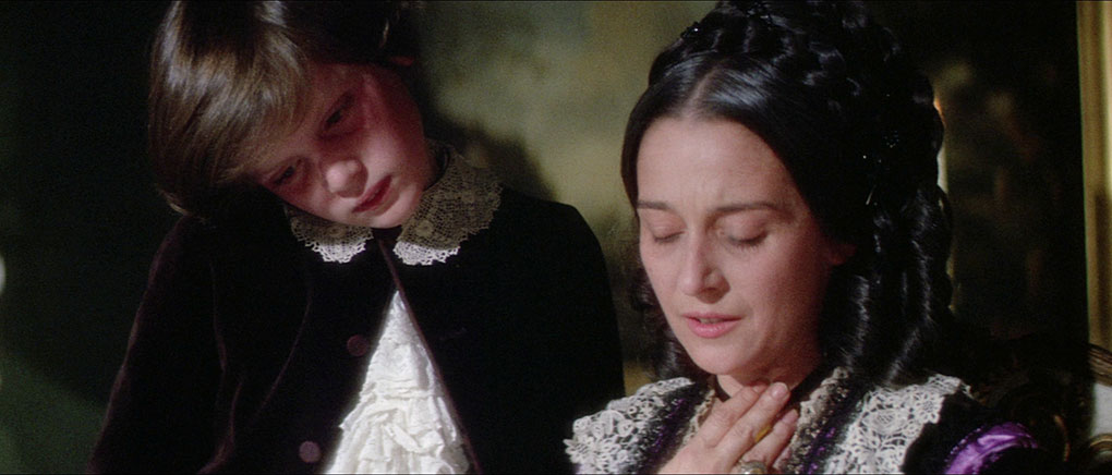 Nadezhda von Meck reacts to the arrival of Pyotr's latest composition, with her young son (played by Alexander Russell) at her side