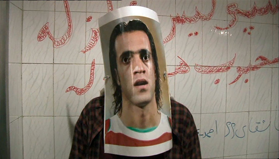 One girl has to wear a poster of a footballer as a mask to use the men's toilets