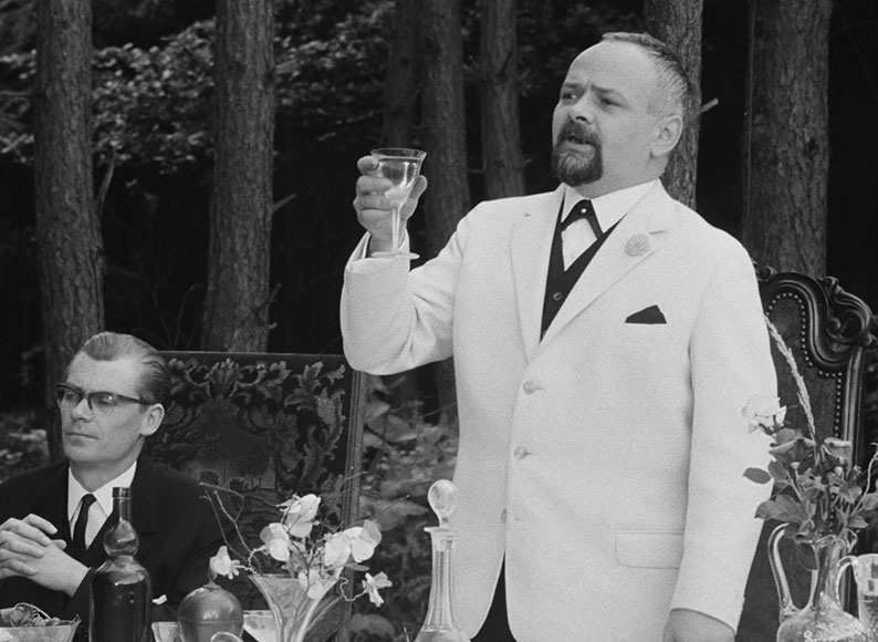 The Host proposes a toast as the newly promoted Josef sits at his right arm