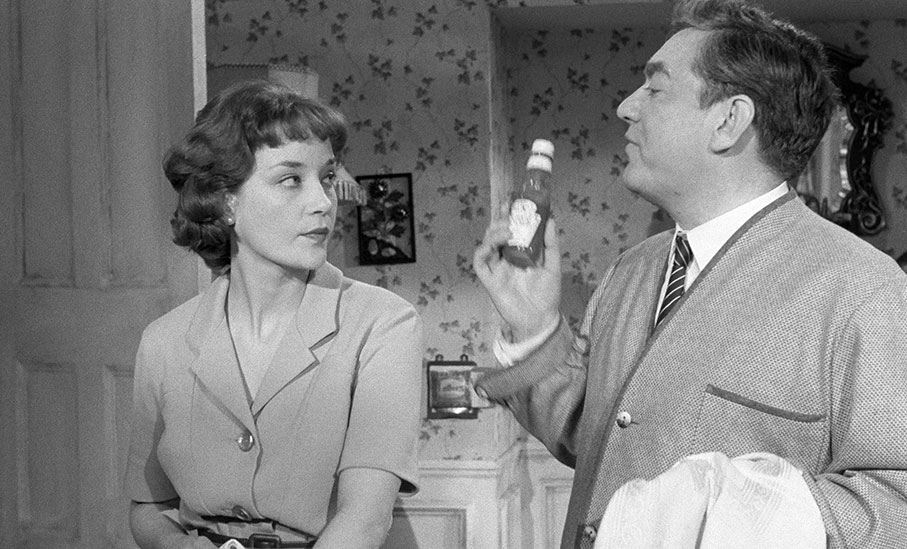 Sylvia Syms as Wally's wife Delia