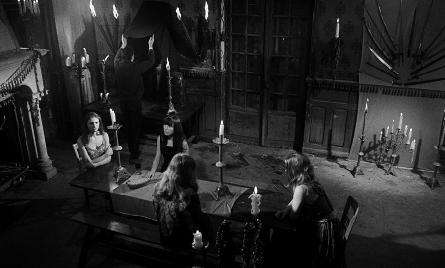 The vampire women await the arrival of the visitors