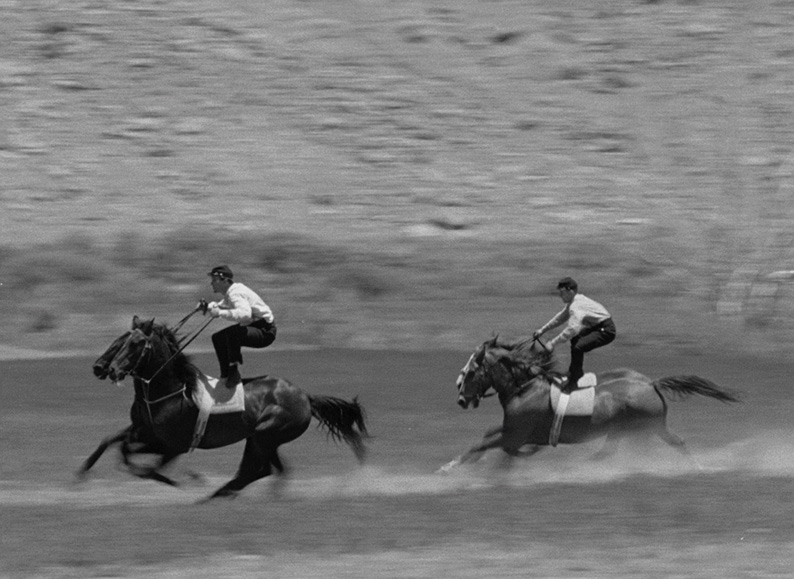 Travis and Sandy ride Roman style