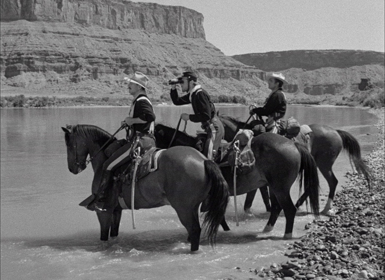 Kirby and Captain Jacques prepare to meet a Mexican party on the Rio Grande