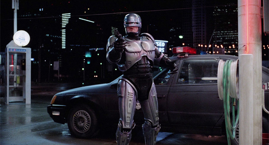 RoboCop confronts Emil at a gas station