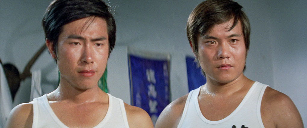 Shao Xiong and Lin Zhi-gang  listen to their master's words