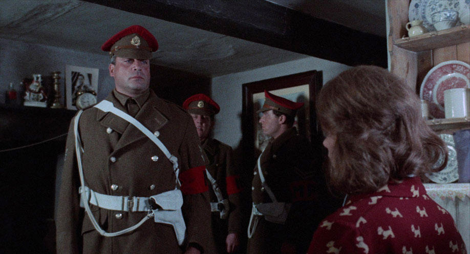 Alice (Glenda Jackson) is confronted by the Sergeant (Oliver Reed)