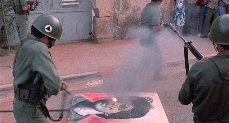 Frustrated soldiers turn on a placard of Rafael