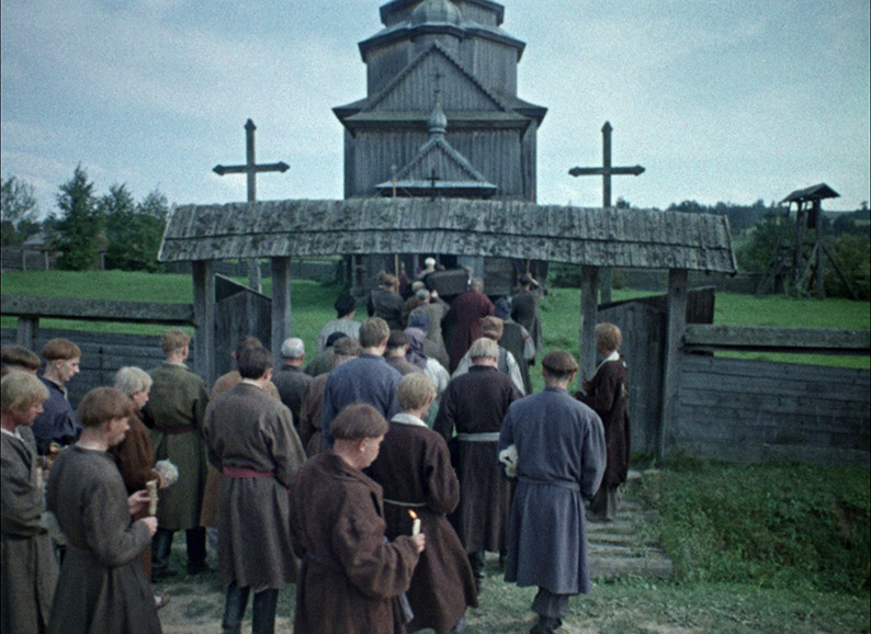 The funeral party heads towards the church in preparation for the vigil