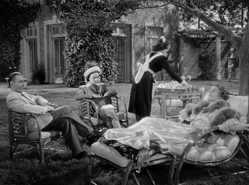 Henry, Janet and Emily relax in the garden after lunch